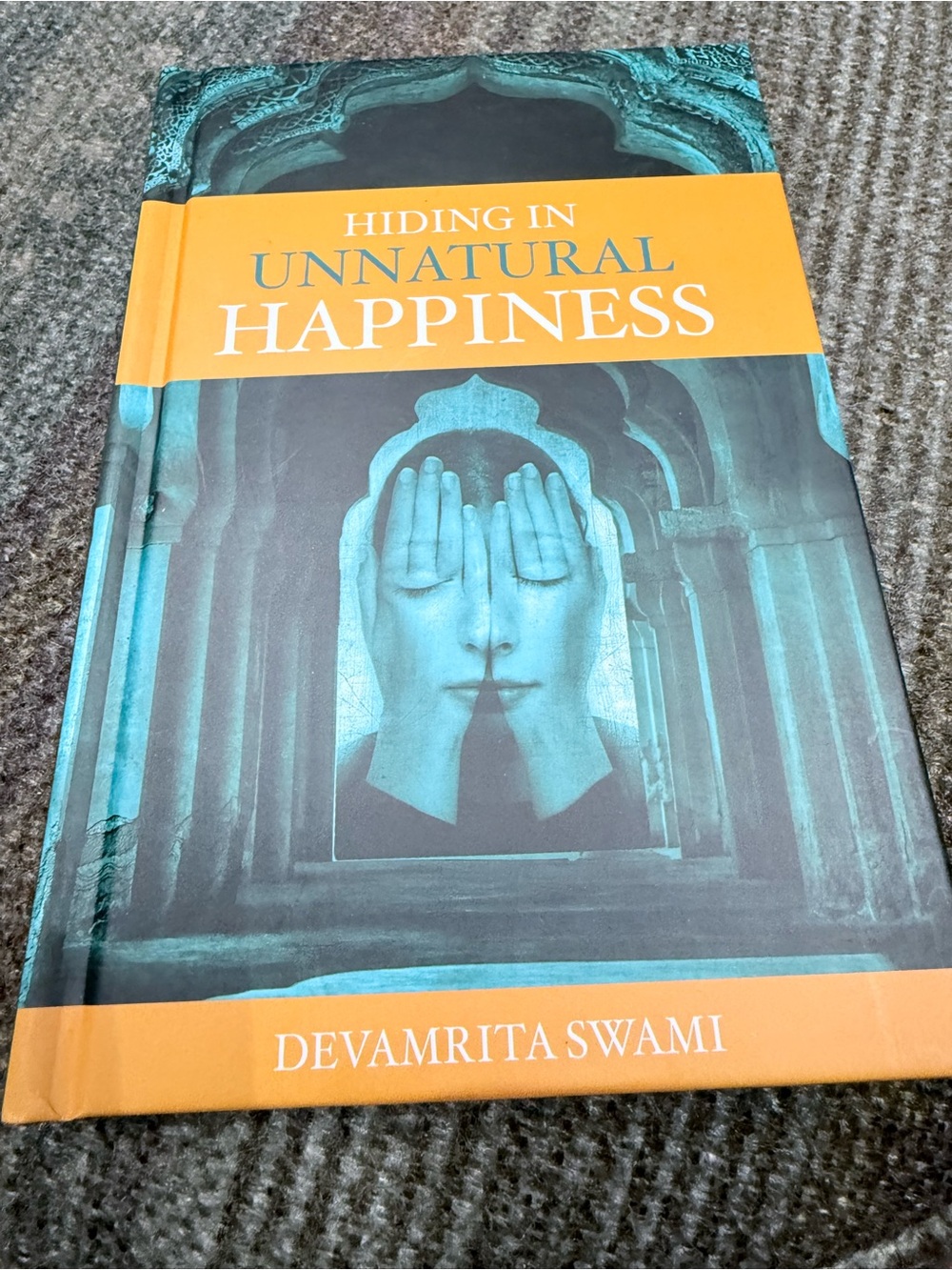 Hiding in Unnatural Happiness by Devamrita Swami